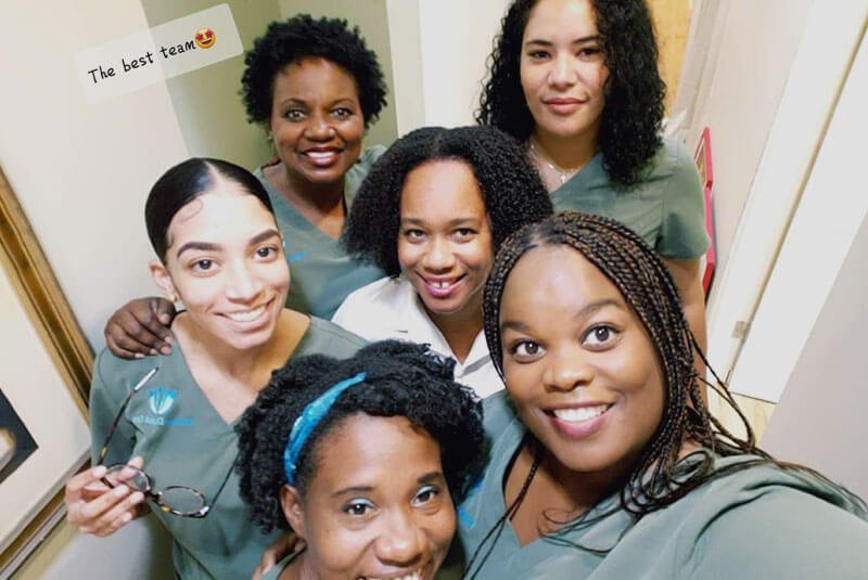 renew dental team smiling in office together